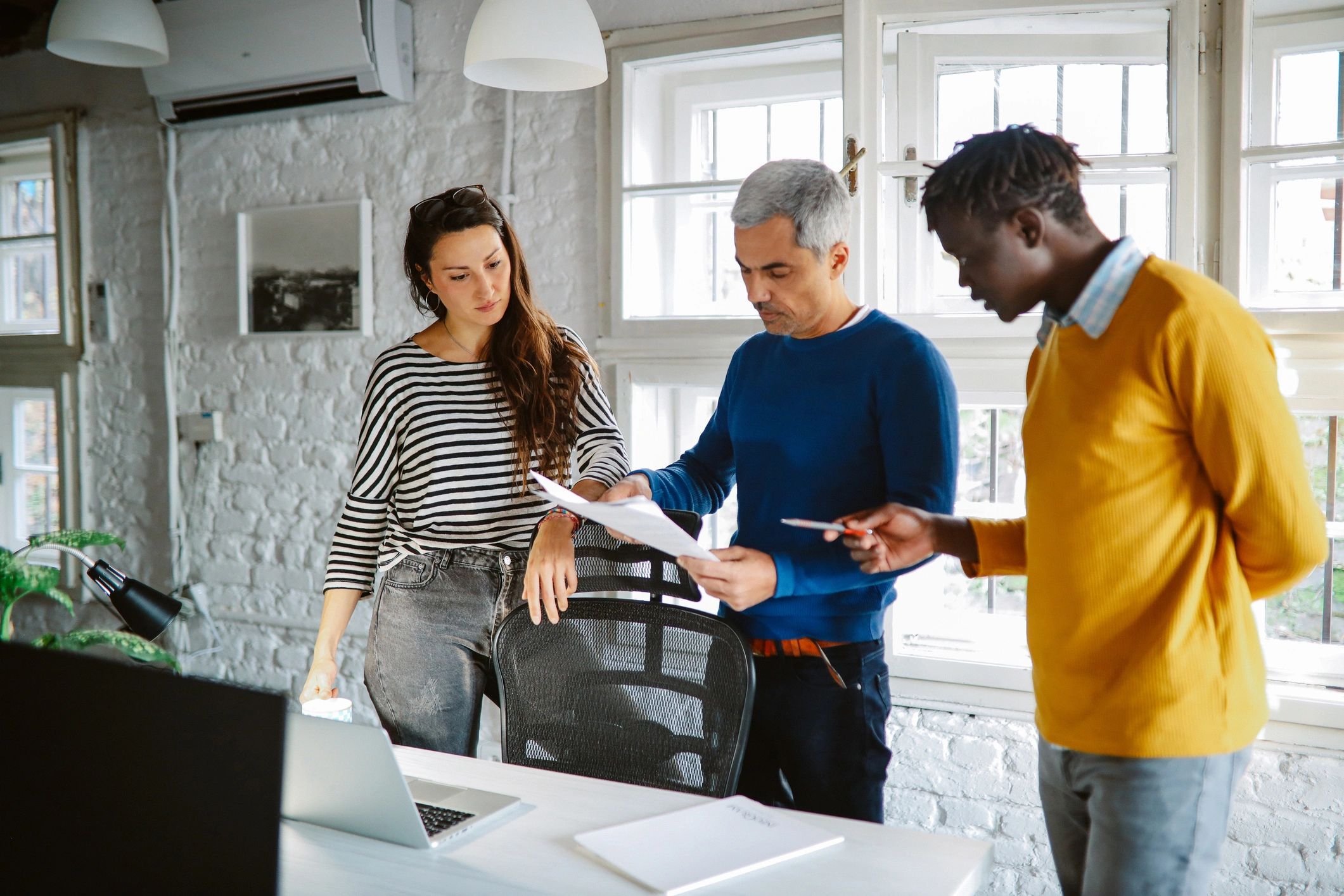 Technology professionals working in a modern office environment