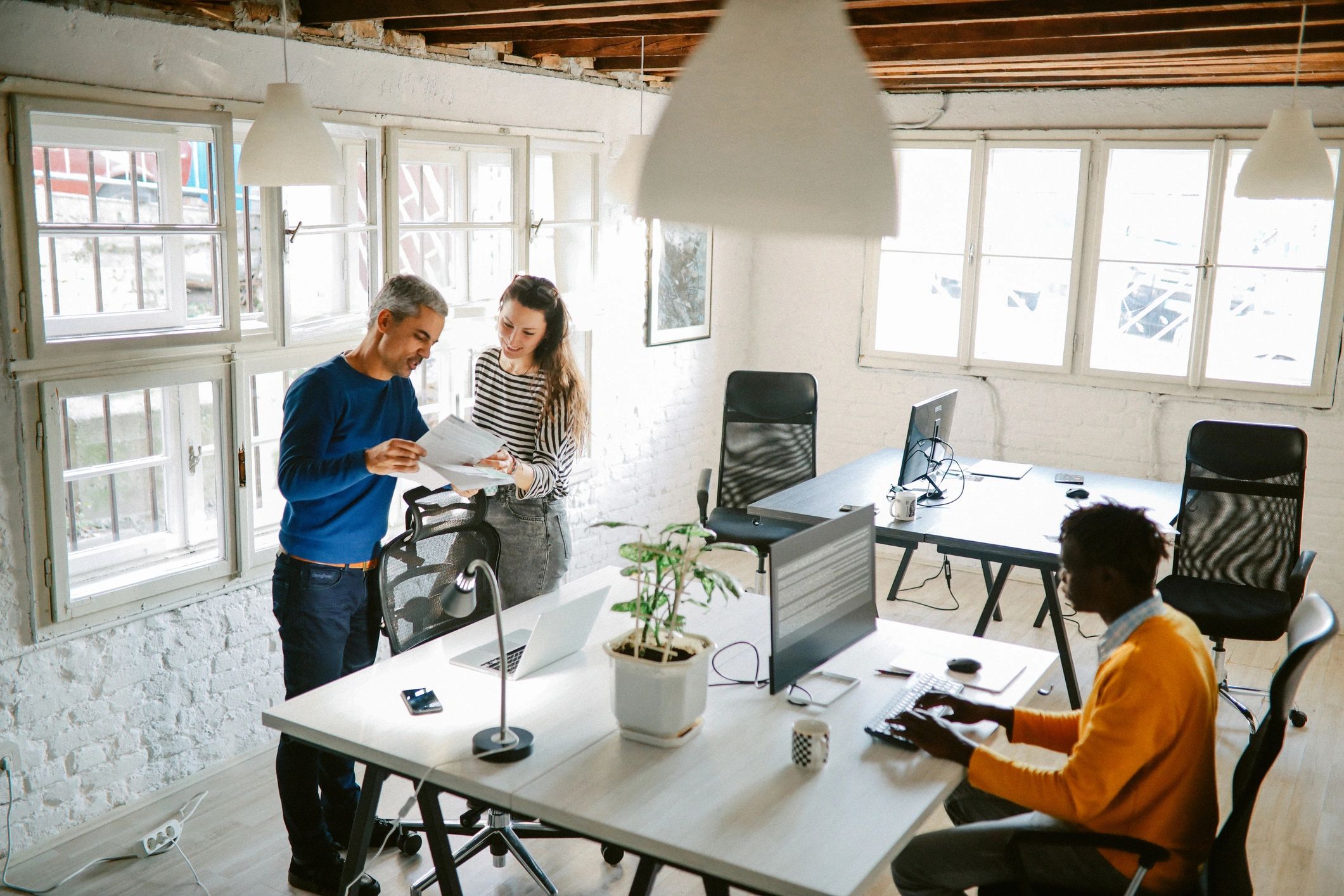 IT professionals collaborating in a modern consulting office