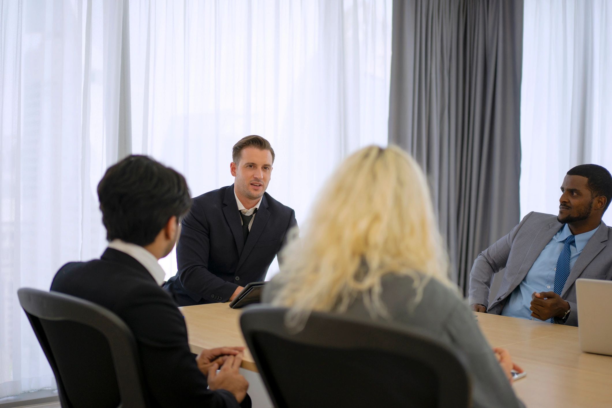 Professional consultants collaborating in a meeting room