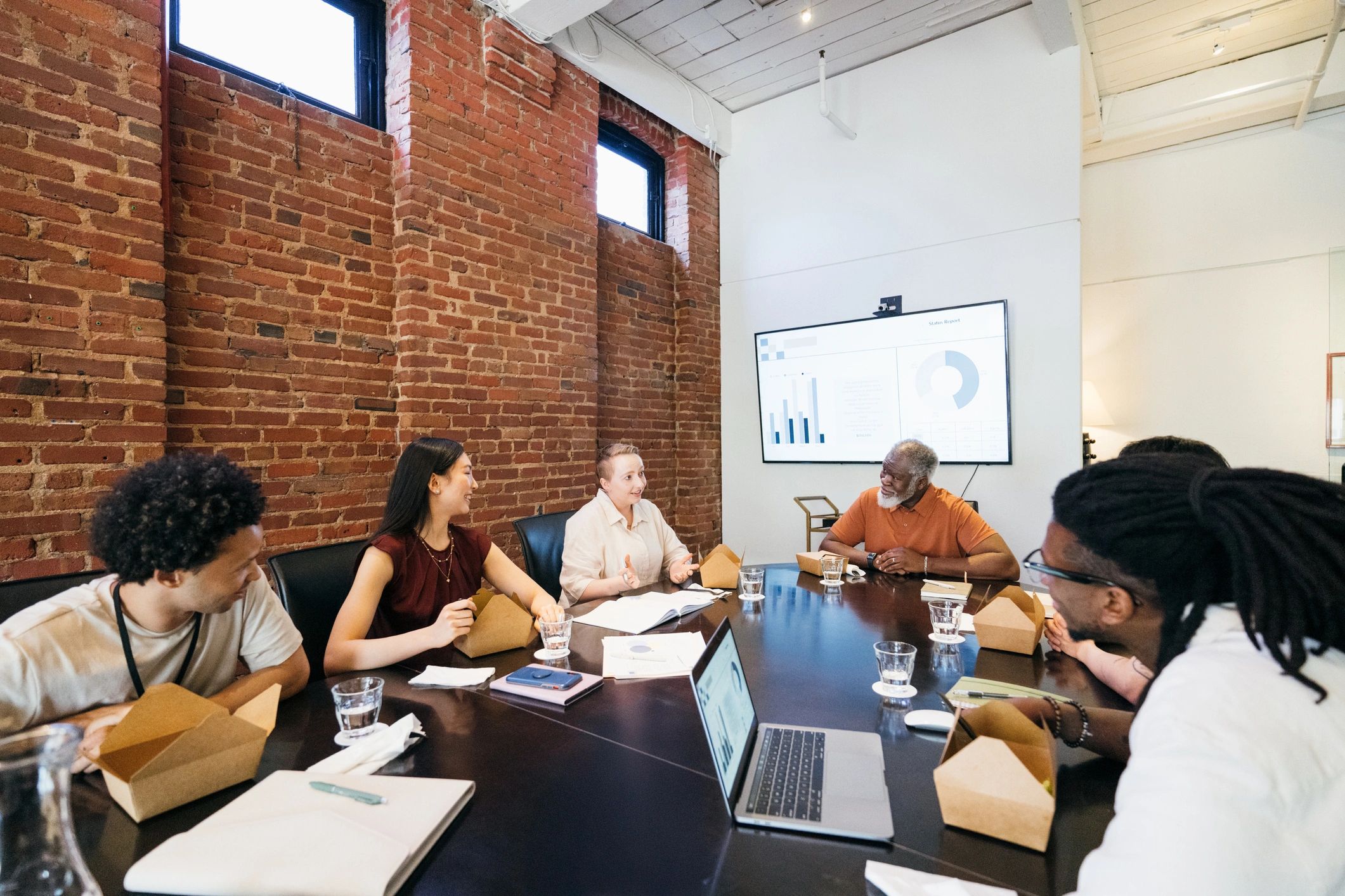 Business team in collaborative boardroom discussion